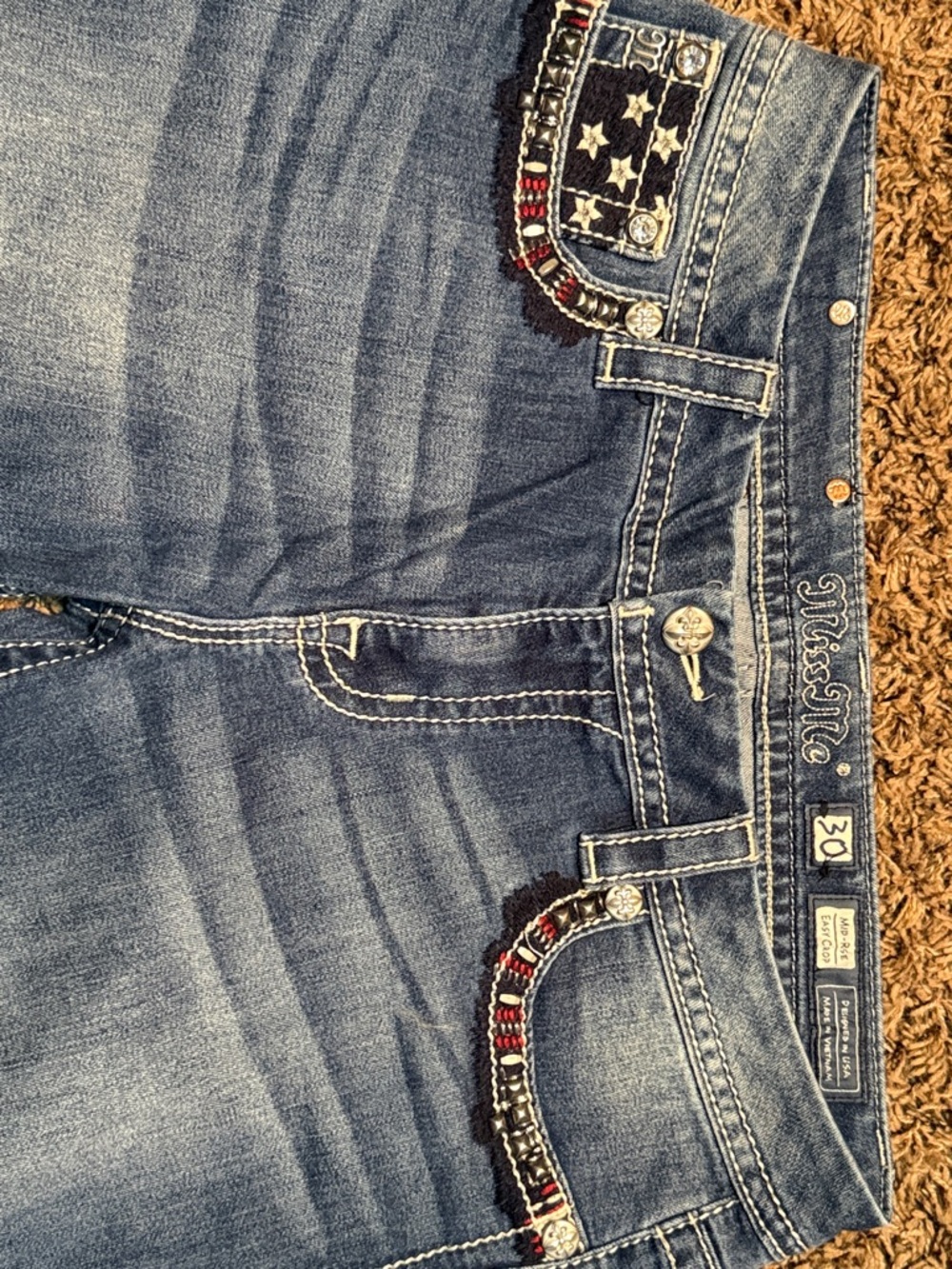 Miss Me Faded Blue Boot Cut Jeans with Red & Silver Pocket Embellishments